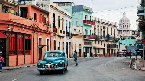 Bleu car driving on Havana street